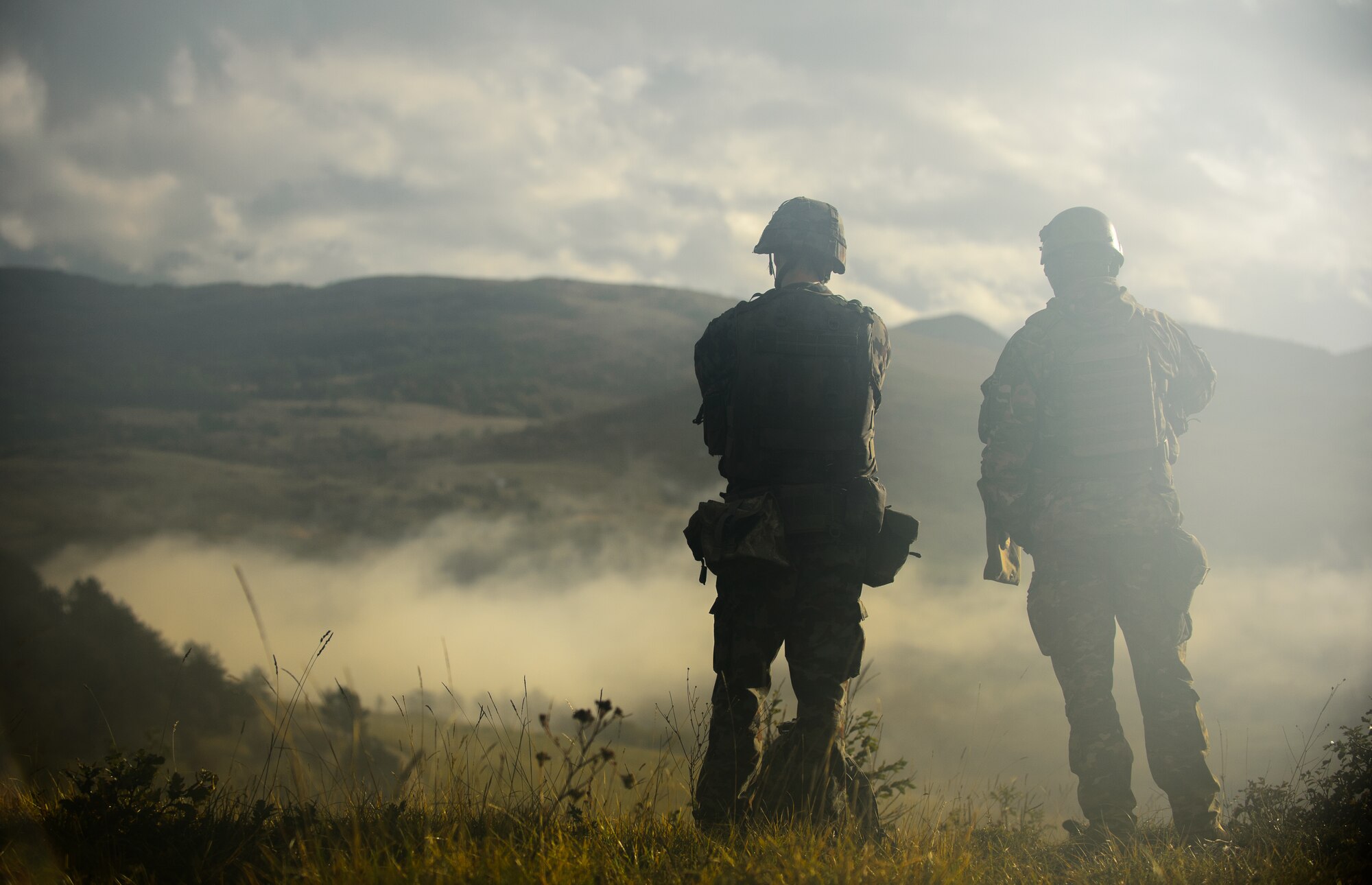 Two Slovenian range control officers survey the Pocek Training Range to determine a training start time during exercise Rock Proof V Oct. 16, 2015, at Postojna, Slovenia. Exercise Rock Proof V brought together U.S. and Slovenian military forces to expand each other’s capabilities and certify service members on a variety of combat tasks. (U.S. Air Force photo/ Staff Sgt. Armando A. Schwier-Morales)