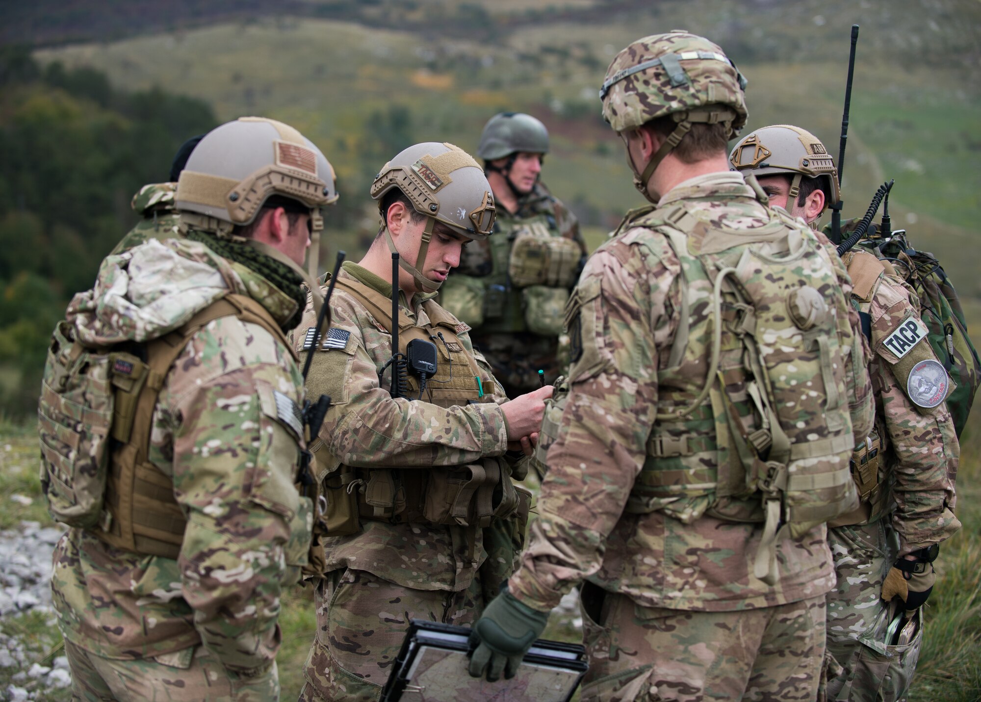 U.S Air Force Senior Airman Gage Duvall, 2nd Air Support Operations Squadron joint terminal attack controller in training, coordinates with U.S. Army soldiers during exercise Rock Proof V Oct. 16, 2015, at the Pocek Training Range, near Postojna, Slovenia. The 2nd ASOS provided close air support for the 2nd Battalion, 503rd Infantry Regiment. (U.S. Air Force photo/Staff Sgt. Armando A. Schwier-Morales)