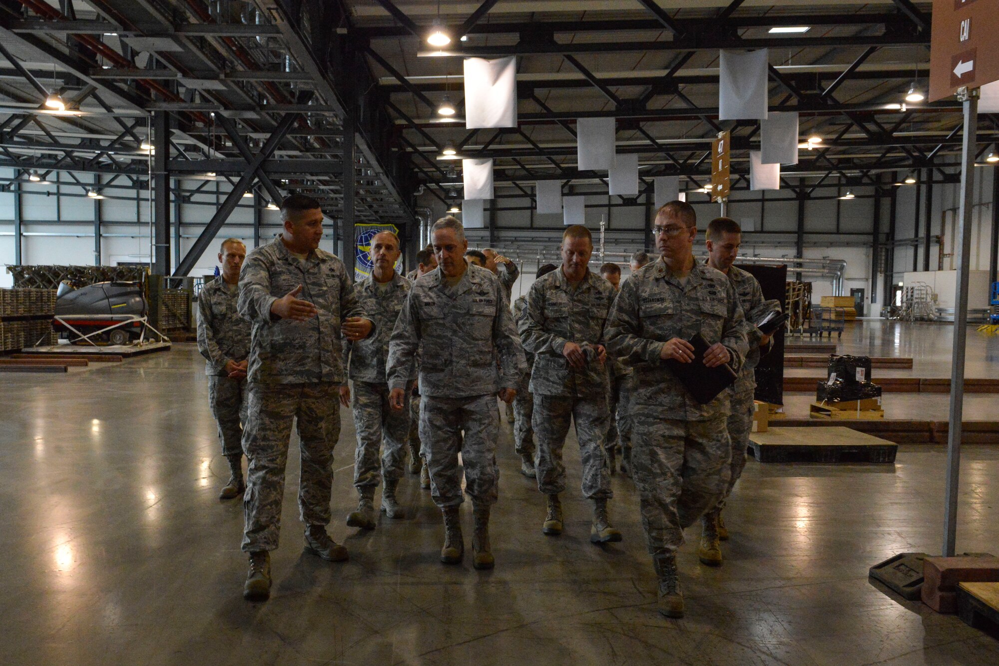Maj. Gen. Frederick H. Rick Martin, U.S. Air Force Expeditionary Center commander, takes a tour of the 721st Aerial Port Squadron Oct. 13, 2015, at Ramstein Air Base, Germany. During his visit, Martin toured different units from the 521st Air Mobility Operations Wing and spoke during an all-call. (U.S. Air Force photo/Senior Airman Nicole Sikorski) 