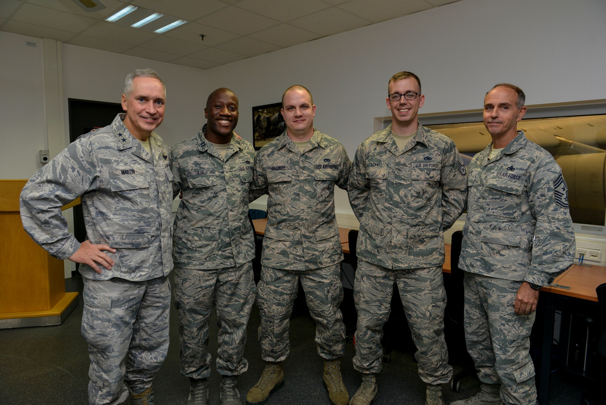 Maj. Gen. Frederick H. Rick Martin, U.S. Air Force Expeditionary Center commander, poses for a group photo with Airmen from the 721st Aircraft Maintenance Squadron Oct. 13, 2015, at Ramstein Air Base, Germany. During his visit to the 721st AMXS, superior performers from the unit explained the aircraft de-icing process and their winter execution plan. (U.S. Air Force photo/Senior Airman Nicole Sikorski)