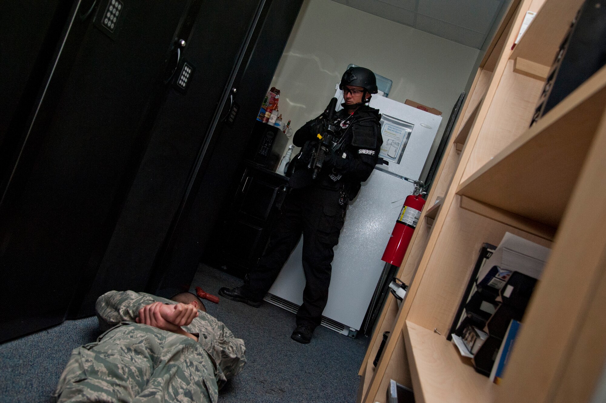 CHEYENNE MOUNTAIN AIR FORCE STATION, Colo. – El Paso County Sheriff’s SWAT Team responds to an active shooter turned hostage exercise scenario in a mission center, Oct. 22, 2015. The exercise brought together the 721st Security Forces Squadron, Cheyenne Mountain Air Force Station Fire Department, 21st Medical Group and El Paso County Sheriff’s SWAT Team to work through the exercise inside the complex. (U.S. Air Force photo by Senior Airman Tiffany DeNault)