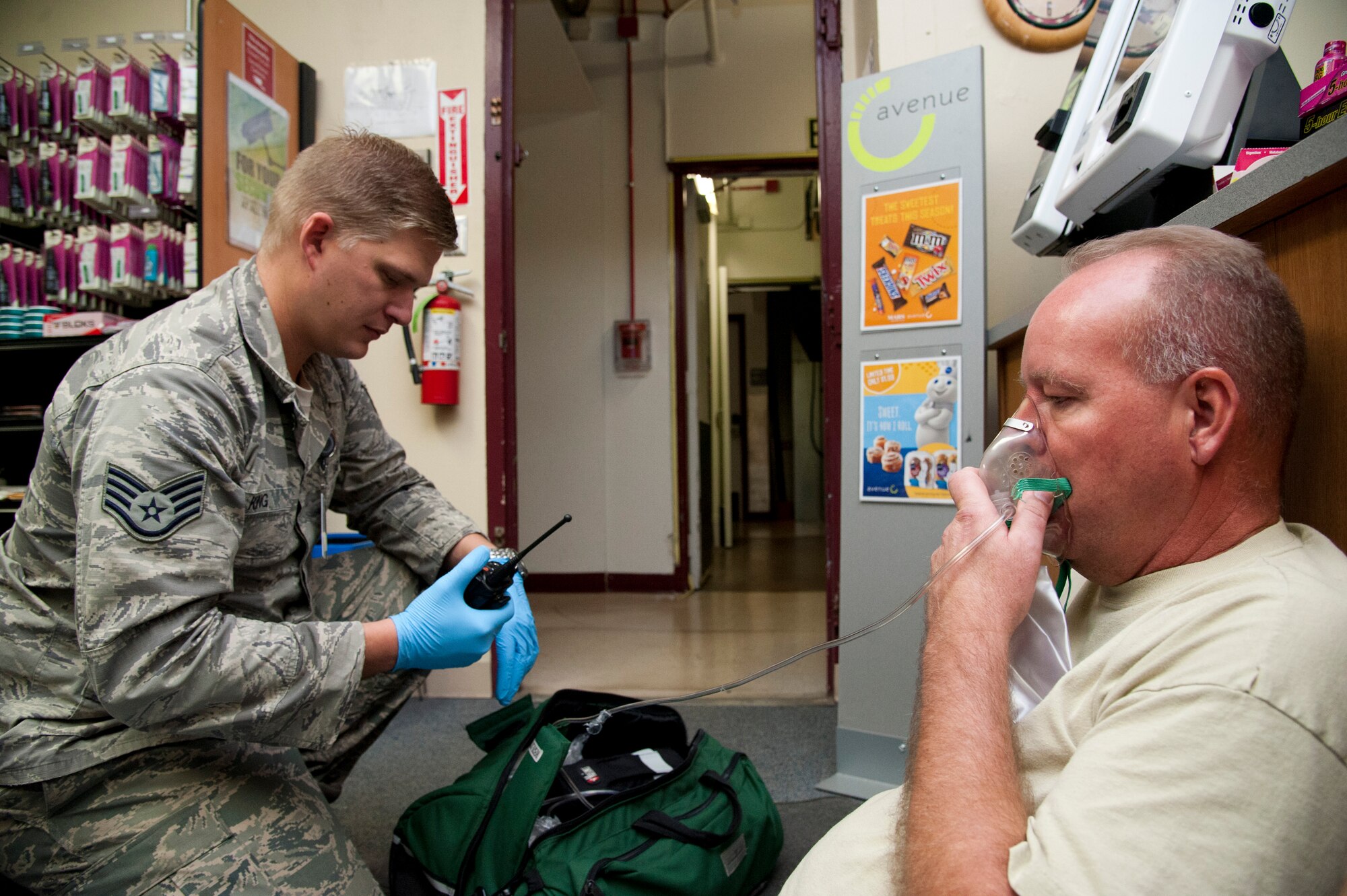 CHEYENNE MOUNTAIN AIR FORCE STATION, Colo. – Staff Sgt. Paul King, 21st Medical Group, simulates administering oxygen to Mark Onken, simulated victim, during an active-shooter exercise in Cheyenne Mountain Air Force Station’s underground complex, Oct. 22, 2015. Part of the active-shooter exercise was intended to overwhelm the medical staff into a triage situation by scattering multiple simulated victims throughout the complex. (U.S. Air Force photo by Senior Airman Tiffany DeNault)