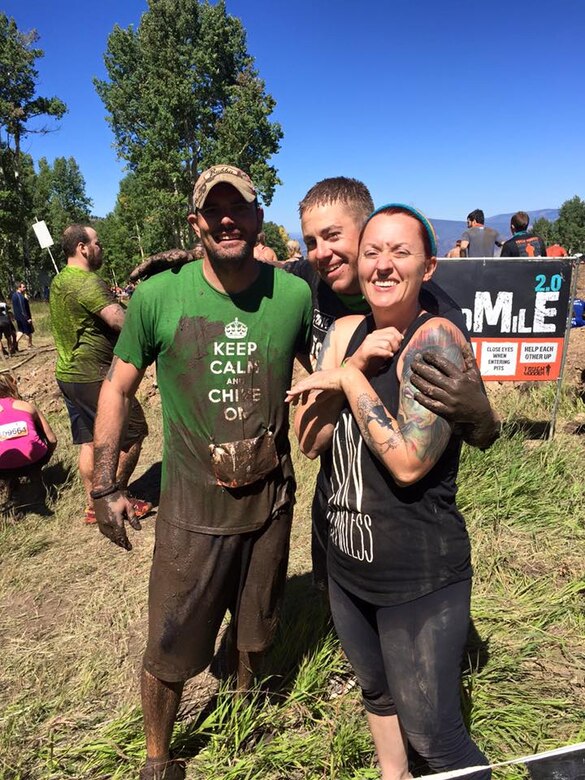 PETERSON AIR FORCE BASE, Colo. -- Tech Sgt. Allan Skelton, Tech Sgt. Jason Sheppard and Skelton’s wife Audree are happy to finish a Tough Mudder event over the summer. Skelton and Shappard are both from the 21st Logistics Readiness Squadron. (courtesy photo)