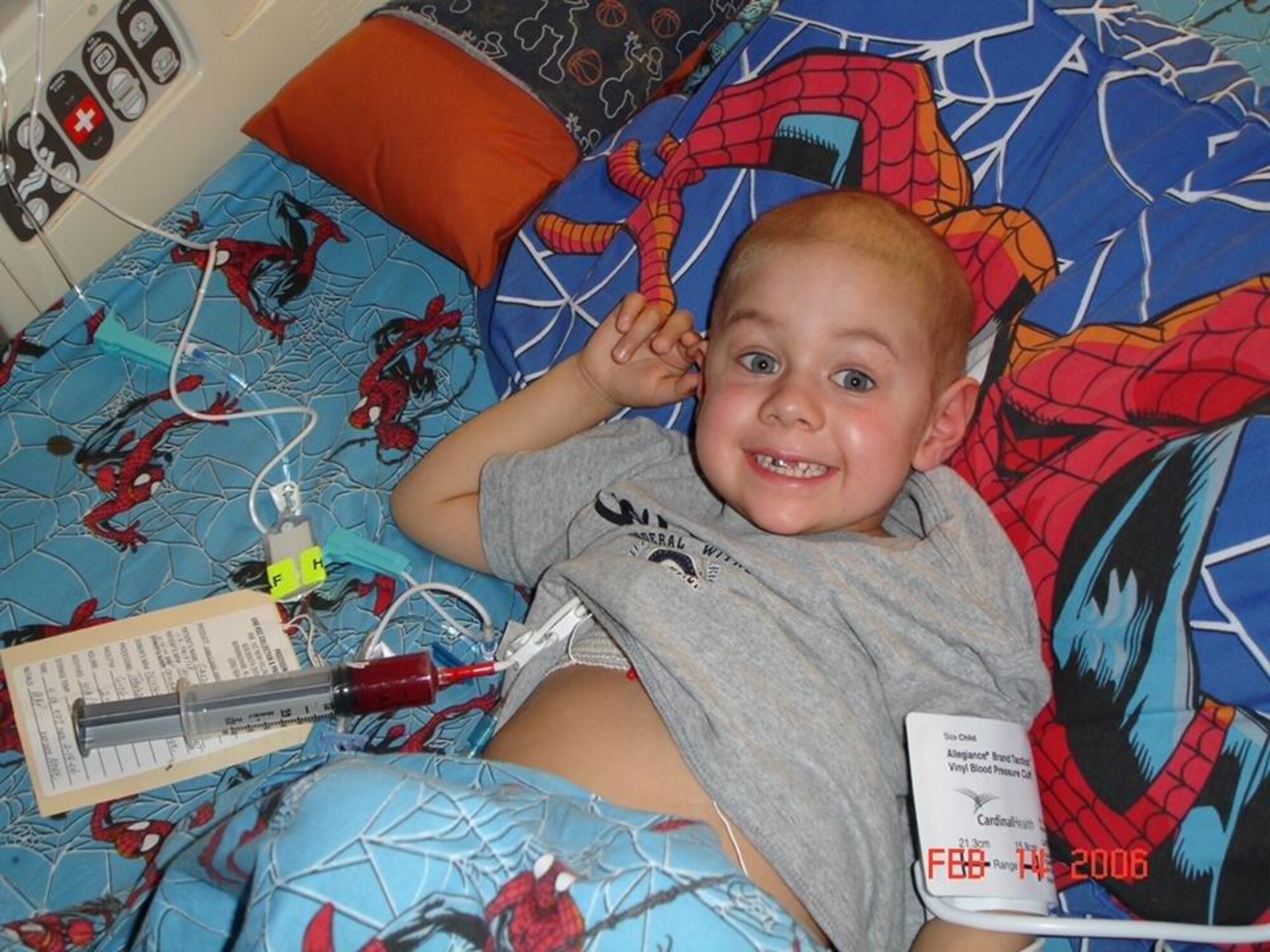 PETERSON AIR FORCE BASE, Colo. -- Tech. Sgt. Billy Gazzaway, 21st Communications Squadron deputy chief of infrastructure, sleeps next to his son, Kadin, after a stem cell transplant. Kadin fought a hard battle, but passed away in 2006 from leukemia. Gazzaway struggled with the loss of his son, turning to alcohol to cope. After admitting he needed help, he was able to begin the healing process. (courtesy photo)