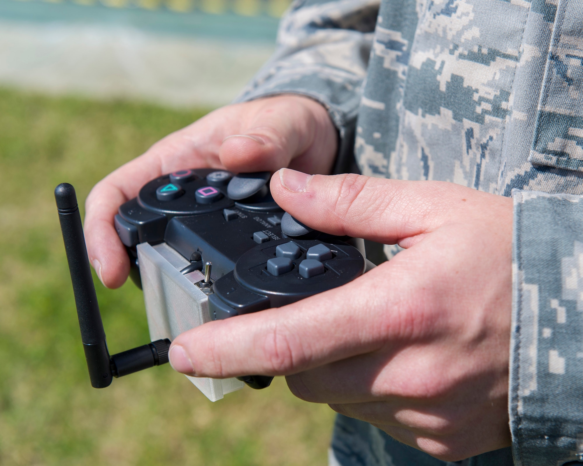 Staff Sgt. Matthew Mong, 45th Weather Squadron NCO in charge training, demonstrates how to use, Pink, a Weather-Bot robot used to help members of the 45th WS release weather balloons without risking human life during lighting, Jan. 27, 2015, at Cape Canaveral Air Force Station, Fla. Many Brevard County students teamed-up with CCAFS and NASA to help better determine weather conditions during rocket launches.  (U.S. Air Force photo/Matthew Jurgens) (Released)  