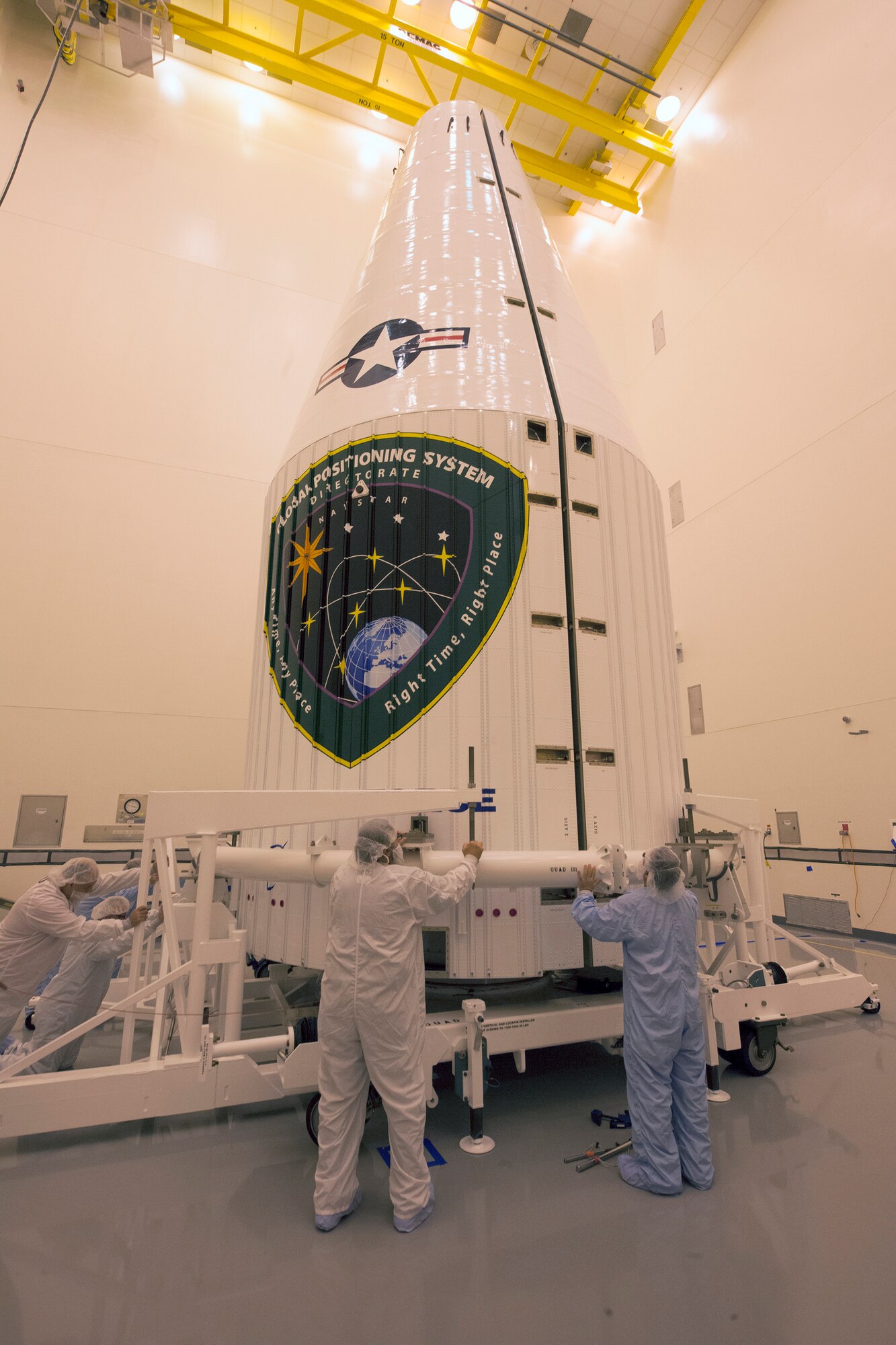 Technicians prepare to close up a Global Positioning System IIF-series satellite within a four-meter diameter protective payload fairing during final encapsulation Oct. 16 at Cape Canaveral Air Force Station, Fla. GPS IIF satellites provide improved signals that will enhance the precise global positioning, navigation and timing services supporting both the warfighter and the growing civilian needs of our global economy. GPS IIF will provide improved navigational accuracy through advanced atomic clocks, a longer design life than previous GPS satellites, and a third operational civil signal (L5) that benefits commercial aviation and safety-of-life applications. The Air Force and its mission partners are scheduled to launch GPS IIF-11 aboard a United Launch Alliance Atlas V 401 launch vehicle Oct. 30 from Space Launch Complex 41 at Cape Canaveral AFS, Fla. The launch window opens at 12:17 p.m. EDT and will remain open for 18 minutes. (Courtesy photo: United Launch Alliance)  