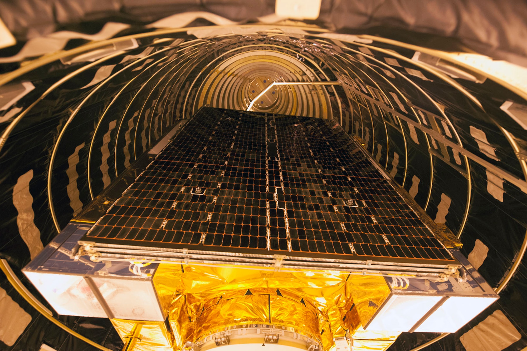 A close-up image of a Global Positioning System IIF-series satellite as it undergoes final encapsulation Oct. 16 at Cape Canaveral Air Force Station, Fla. GPS IIF satellites provide improved signals that will enhance the precise global positioning, navigation and timing services supporting both the warfighter and the growing civilian needs of our global economy. GPS IIF will provide improved navigational accuracy through advanced atomic clocks, a longer design life than previous GPS satellites, and a third operational civil signal (L5) that benefits commercial aviation and safety-of-life applications. The Air Force and its mission partners are scheduled to launch GPS IIF-11 aboard a United Launch Alliance Atlas V 401 launch vehicle Oct. 30 from Space Launch Complex 41 at Cape Canaveral AFS, Fla. The launch window opens at 12:17 p.m. EDT and will remain open for 18 minutes. (Courtesy photo: United Launch Alliance)  