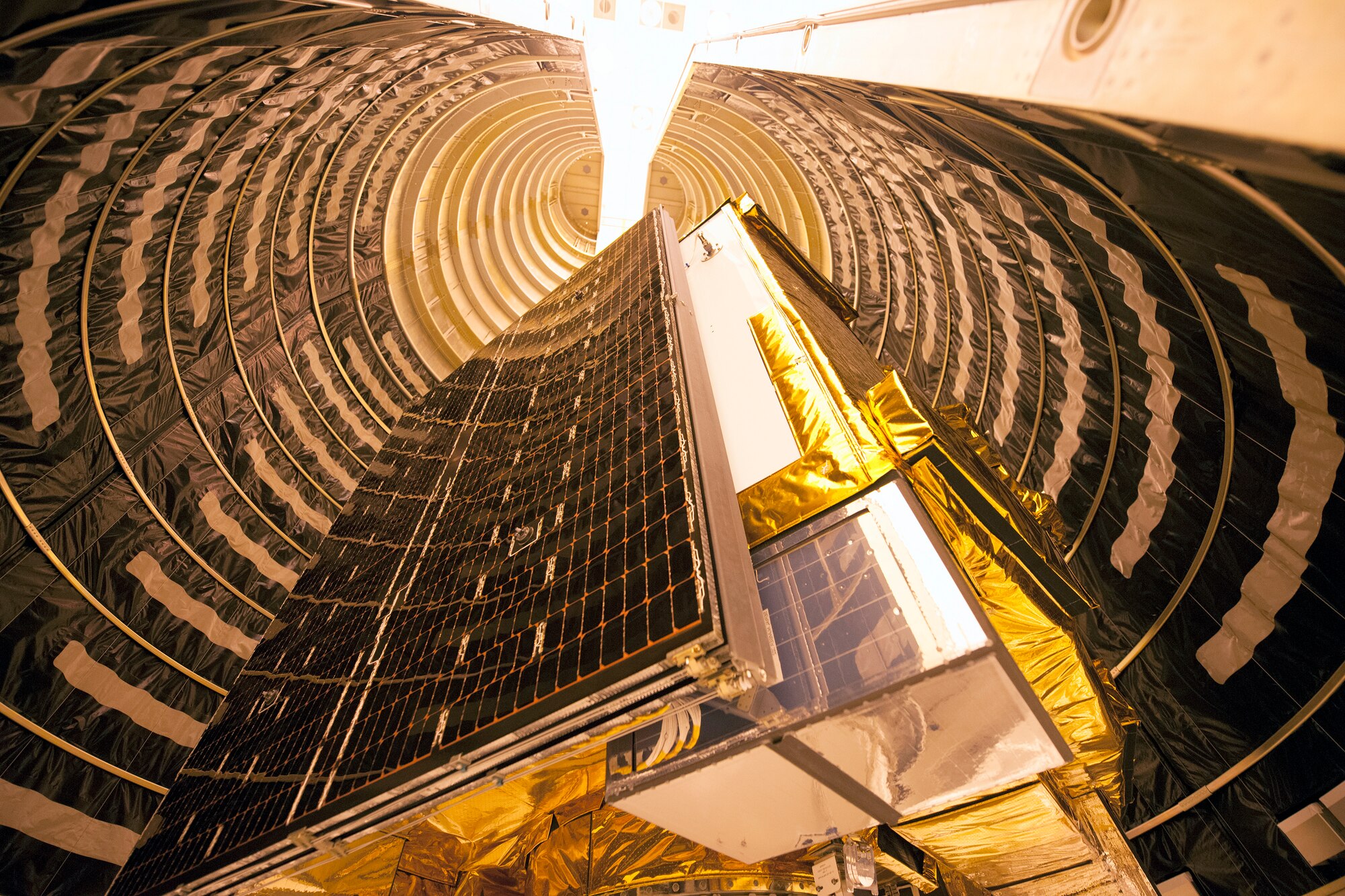 A Global Positioning System IIF-series satellite undergoes final encapsulation inside a four-meter diameter protective payload fairing Oct. 16 at Cape Canaveral Air Force Station, Fla. GPS IIF satellites provide improved signals that will enhance the precise global positioning, navigation and timing services supporting both the warfighter and the growing civilian needs of our global economy. GPS IIF will provide improved navigational accuracy through advanced atomic clocks, a longer design life than previous GPS satellites, and a third operational civil signal (L5) that benefits commercial aviation and safety-of-life applications. The Air Force and its mission partners are scheduled to launch GPS IIF-11 aboard a United Launch Alliance Atlas V 401 launch vehicle Oct. 30 from Space Launch Complex 41 at Cape Canaveral AFS, Fla. The launch window opens at 12:17 p.m. EDT and will remain open for 18 minutes. (Courtesy photo: United Launch Alliance)  