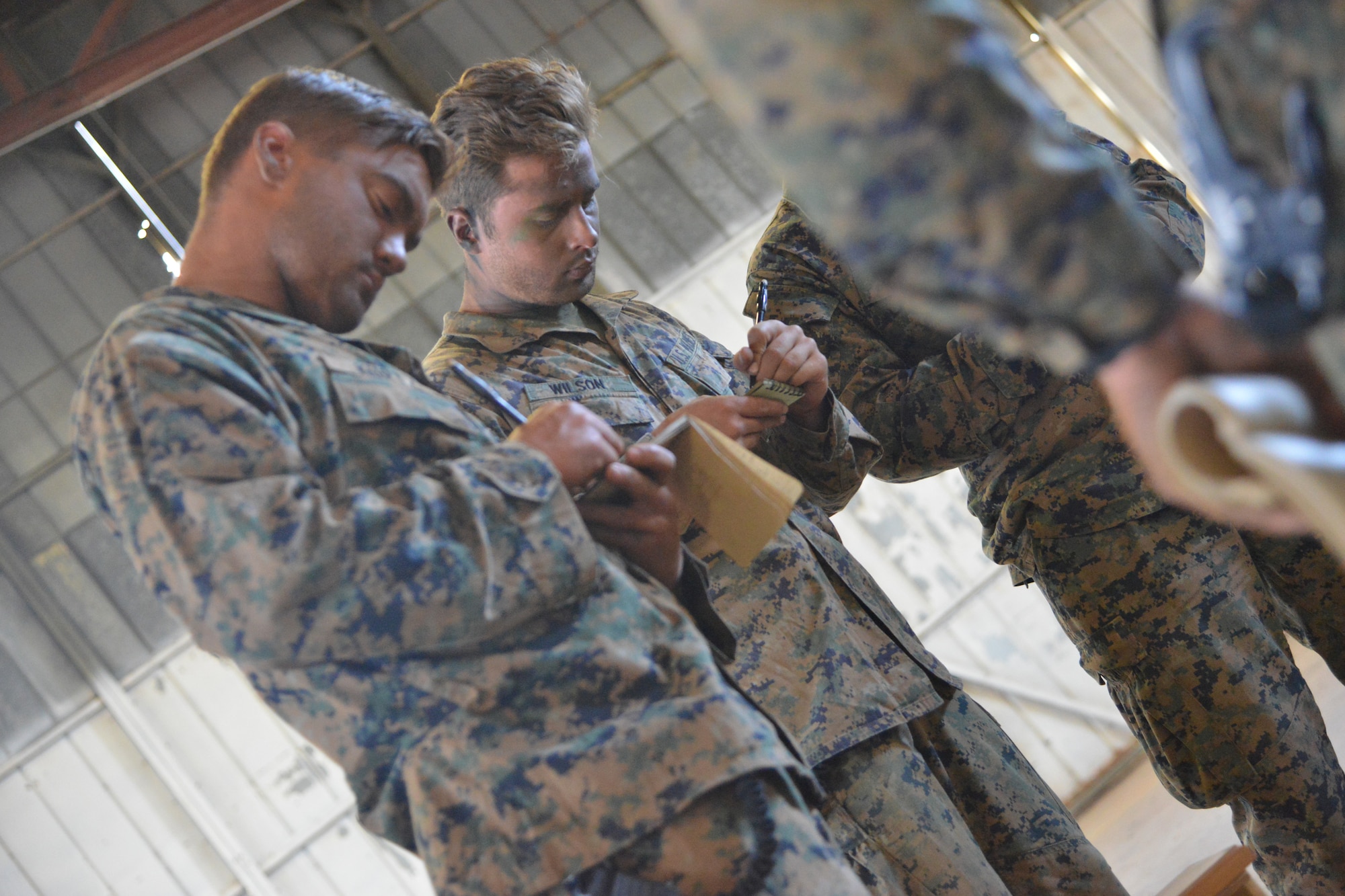 Members of Alpha Company, 1st Recon Battalion, 1st Marine Division conduct a mission brief prior to beginning a joint exercise with 58th Special Operations Wing, on Kirtland AFB.  During the event members of Alpha Company and the 58th conducted joint support battlespace shaping operations ahead of advancing friendly forces. The multi-day exercise was designed to test inter-operability between the Marines and Air Force troops through close air support and casualty evacuation scenarios. (Photo by Todd Berenger)
