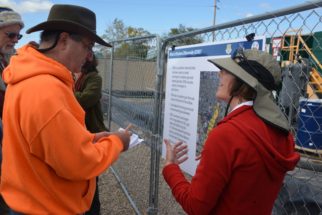 Dr. Adria Bodour, Air Force Civil Engineer Center, talks to a concerned citizen at a tour of Kirtland's Bulk Fuels Facility Oct. 24. Bodour is the Air Force's lead scientist working on the fuel spill cleanup. (Photo by Dennis Carlson)