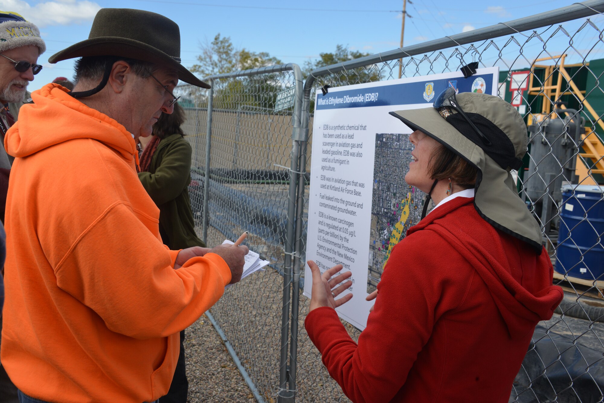 Dr. Adria Bodour, Air Force Civil Engineer Center, talks to a concerned citizen at a tour of Kirtland's Bulk Fuels Facility Oct. 24. Bodour is the Air Force's lead scientist working on the fuel spill cleanup. (Photo by Dennis Carlson)
