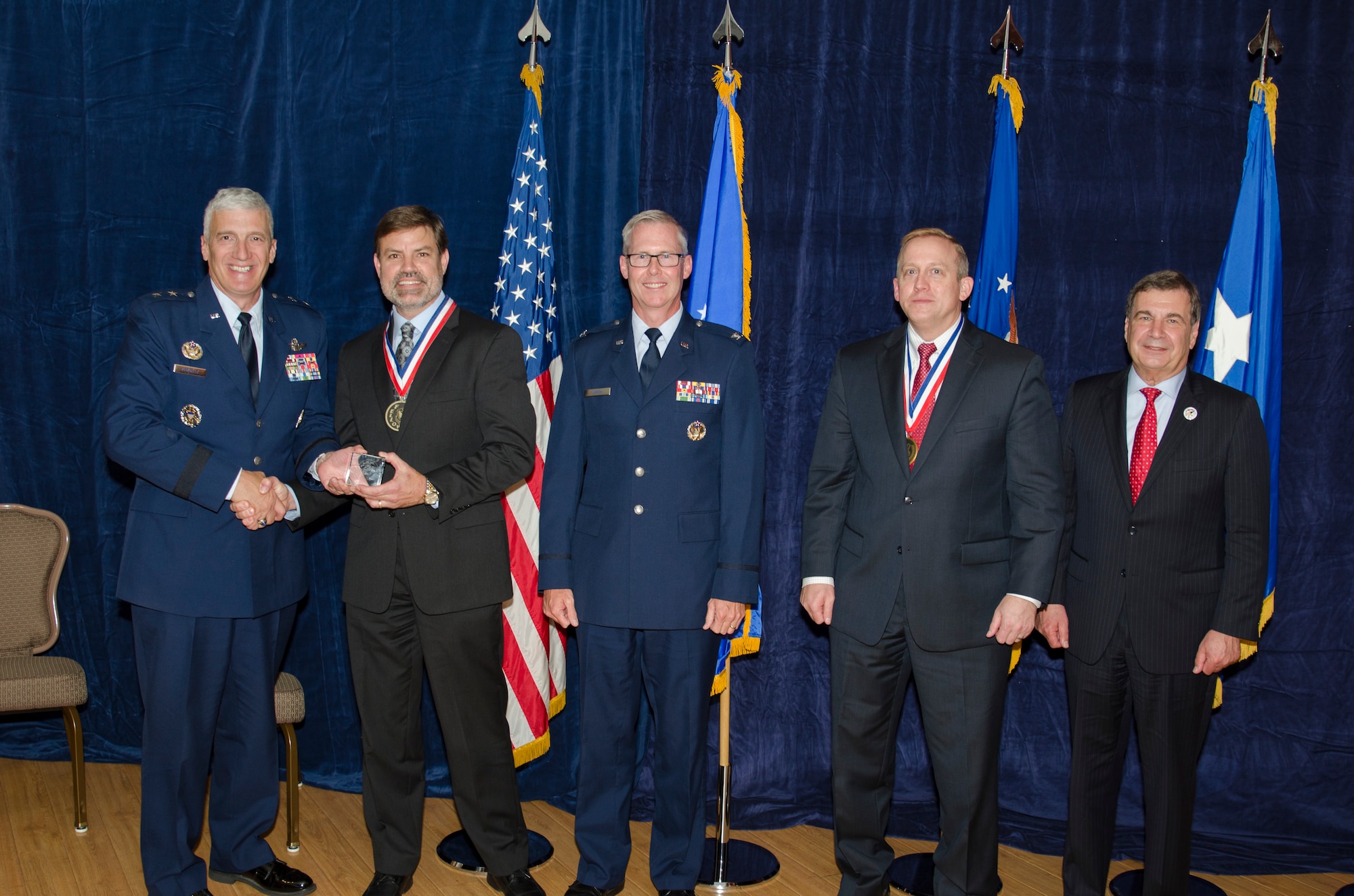 Dr. Robert Murphey, the Munition Airframe Guidance Navigation and Controls Core Technical Competency Lead for the Munitions Directorate, was inducted into the AFRL Fellows Program on October 22, at the 2015 Fellows Ceremony, which took place at the Wright-Patterson Club. Pictured from left to right are AFRL Commander Maj. Gen. Thomas Masiello, Dr. Robert Murphey, Col. Scott Martin, AFRL Chief Technologist Dr. Morley Stone and Air Force Chief Scientist Dr. Greg Zacharias. (U.S. Air Force photo/Michael Huber)