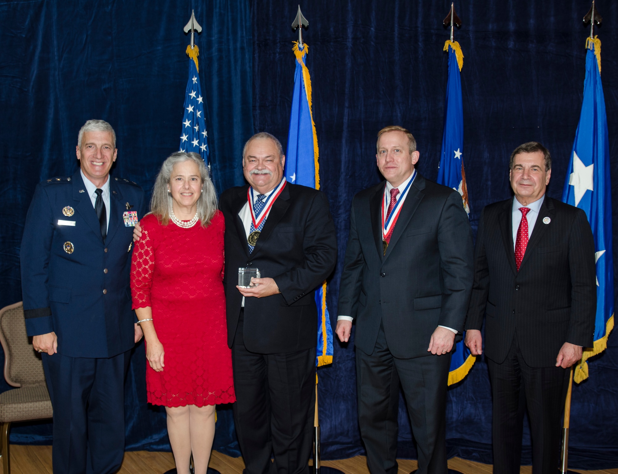 Mr. Kevin Slimak, the Advanced GPS Technology Program Manager for the Space Vehicles Directorate, was inducted into the AFRL Fellows Program on October 22, at the 2015 Fellows Ceremony, which took place at the Wright-Patterson Club. Pictured from left to right are AFRL Commander Maj. Gen. Thomas Masiello, Mrs. Slimak, Mr. Kevin Slimak, AFRL Chief Technologist Dr. Morley Stone and Air Force Chief Scientist Dr. Greg Zacharias. (U.S. Air Force photo/Michael Huber)