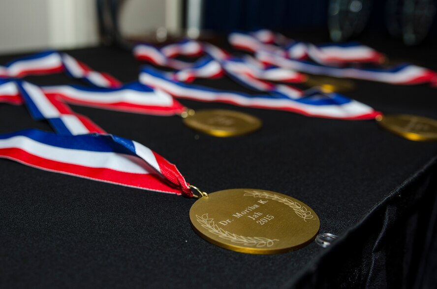 Medallions were laid out in preparation to honor the new  inductees at the Fellows Ceremony, which took place at the Wright-Patterson Club on Thursday, October 22. The Fellows Program recognizes only the AFRL's most outstanding scientists and engineers and awards them with a $300K research grant. (U.S. Air Force photo/Michael Huber)