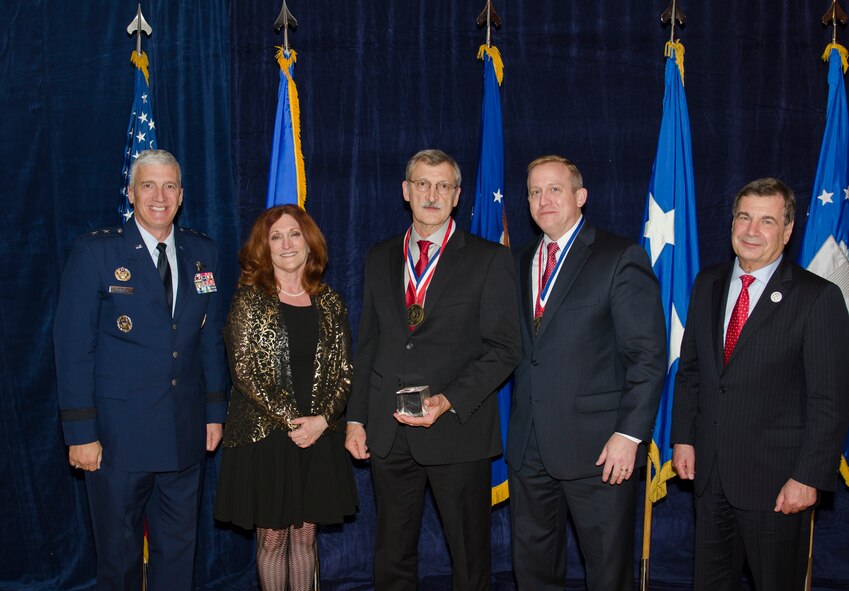 Mr. Byron Edmonds, a Materials Research Engineer for the Materials and Manufacturing Directorate,  was inducted into the AFRL Fellows Program on October 22, at the 2015 Fellows Ceremony, which took place at the Wright-Patterson Club. Pictured from left to right are AFRL Commander Maj. Gen. Thomas Masiello, Mrs. Edmonds, Mr. Byron Edmonds, AFRL Chief Technologist Dr. Morley Stone, and Air Force Chief Scientist Dr. Greg Zacharias. (U.S. Air Force photo/Michael Huber)