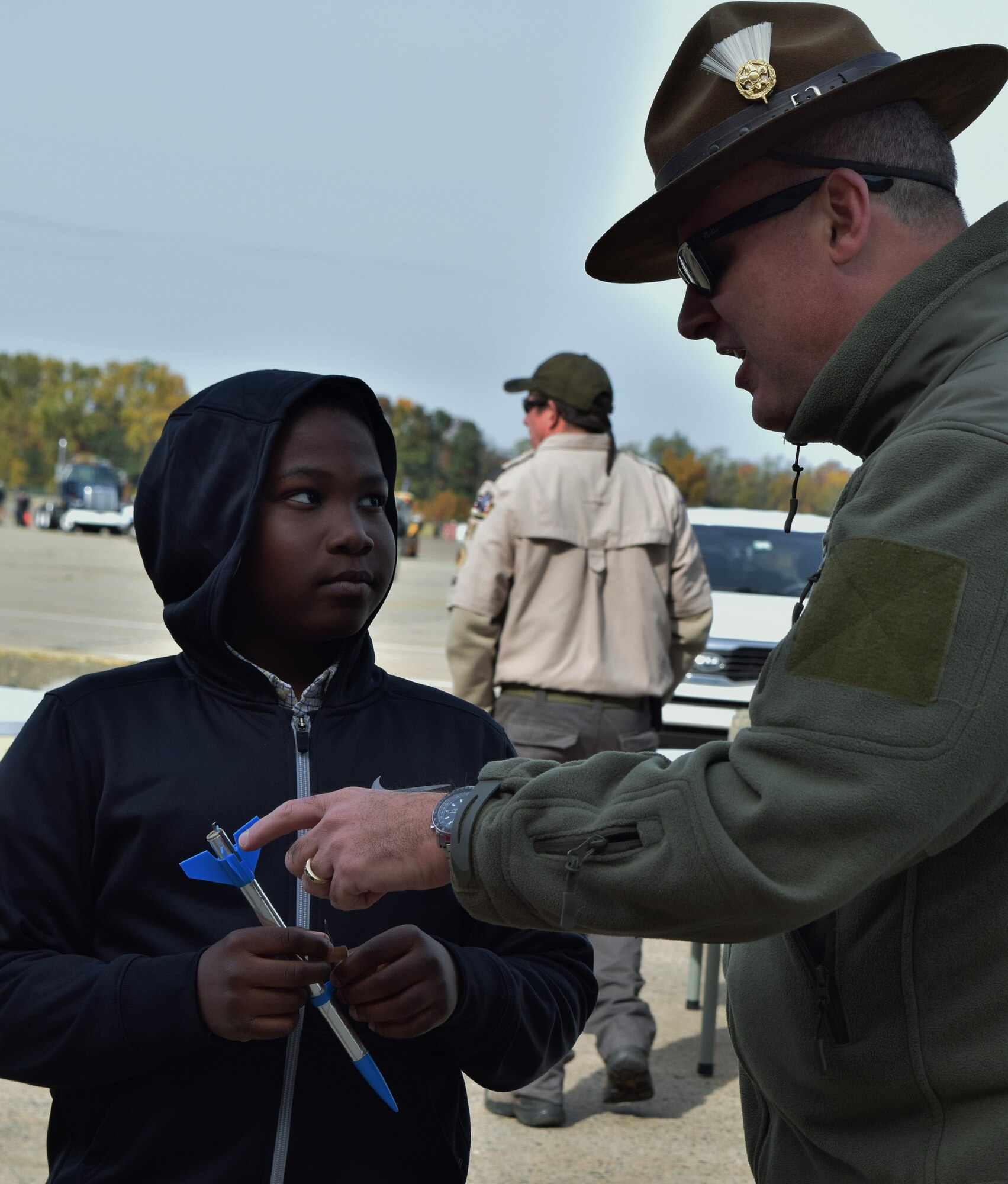 Tom Knight, Pack 577 Cub Master, Cradle of Liberty Council of the Boy Scouts of America, explains the rocket launching process to Cub Scout Rafael Cadet as they wait in line during the “Rocket Into Scouting” recruiting event held Oct. 24, 2015 at Horsham Air Guard Station. The Wing hosted nearly 700 Scouts and their family members, helping them with the rocket launch while also providing food, static displays, tours and interactive attractions. (U.S. Air National Guard photo by U.S. Air National Guard photo by Tech. Sgt. Andria Allmond/Released)