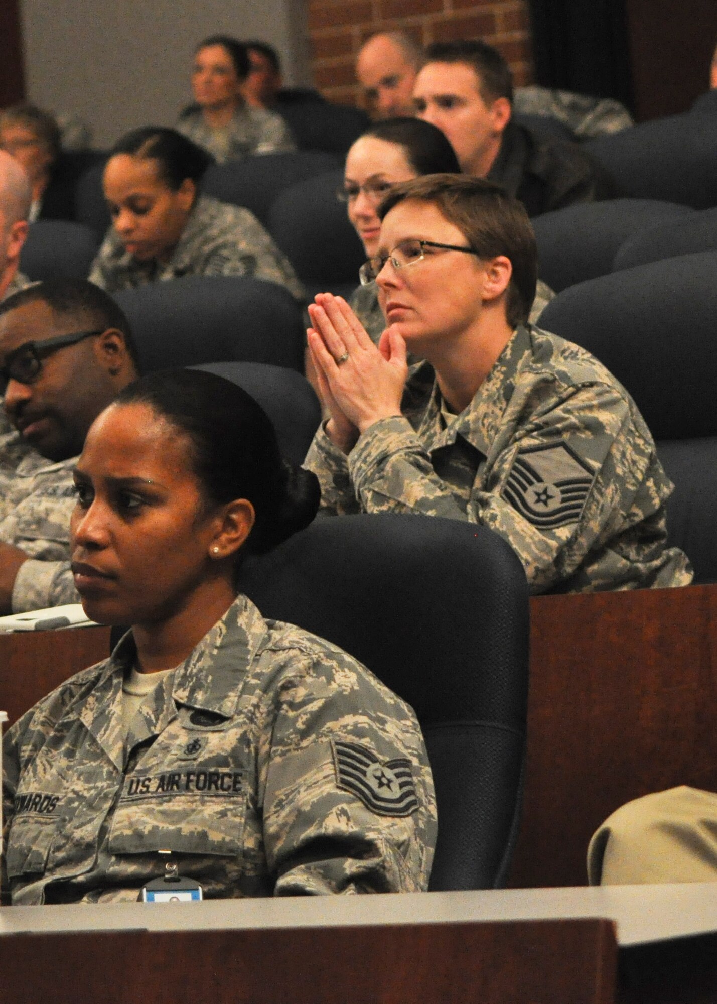 Audience members listen during the Battle of the Bulge symposium held at the U.S. Air Force Expeditionary Center Oct. 21, 2015. World War II veterans Lt. Col. (ret.) Bob Hansen and John Schaffner spoke about their experiences during WWII and watched the Emmy Award winning documentary Searching for Augusta: The Forgotten Angel of Bastogne. (U.S. Air Force Photo/Capt. Matthew Chism)
