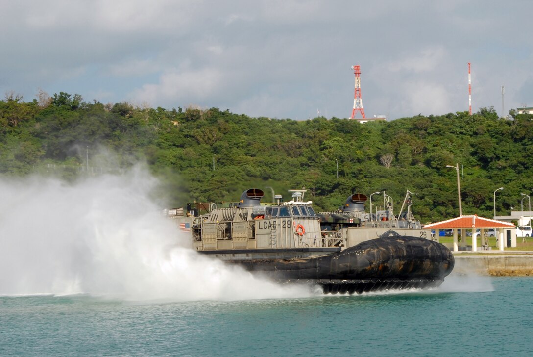 Landing Craft Air Cushion (LCAC) 29 assigned to Naval Beach Unit (NBU) 7 departs Naval Facility White Beach en route to the amphibious dock landing ship USS Germantown (LSD 42). Germantown with embarked Marines from 3rd Marine Division, 1st Marine Aircraft Wing and 3rd Marine Logistics Group will participate in exercise Blue Chromite. Blue Chromite is an amphibious training exercise conducted with the 4th Marine Regiment, Marine Air Group 36, Combat Logistics Regiment 4, and other elements of III Marine Expeditionary Force. Germantown is on patrol in the U.S. 7th Fleet area of operation in support of security and stability in the Indo-Asia-Pacific region. (U.S. Navy Photo by Lt. David A. Levy/Released)