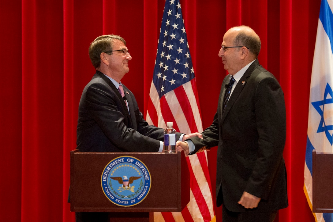 U.S. Defense Secretary Ash Carter shakes hands with Israeli Defense Minister Moshe Yaalon as they speak to a class of U.S. and international students at National Defense University, Washington, D.C., Oct. 27, 2015. Both leaders also met to discuss matters of mutual importance. DoD photo by Air Force Senior Master Sgt. Adrian Cadiz