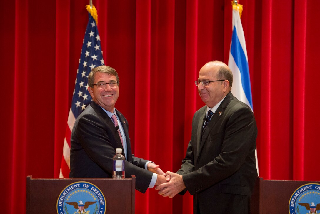 U.S. Defense Secretary Ash Carter shakes hands with Israeli Defense Minister Moshe Yaalon as they conclude speaking to a class of U.S. and international students at National Defense University, Washington, D.C., Oct. 27, 2015. Both leaders also met to discuss matters of mutual importance. DoD photo by Air Force Senior Master Sgt. Adrian Cadiz