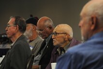 A group of National Air and Space Intelligence Center Alumni Association members listens to Col. Leah Lauderback, NASIC commander, and Curtis Rowland, NASIC chief scientist, present a center update during their annual meeting Friday, Oct. 23, 2015 at Wright-Patterson Air Force Base, Ohio. The association board hosts annual events designed to embrace the organization’s history while allowing members to reconnect.  (U.S. Air Force photo by Master Sgt. Tammie Moore)	
