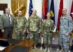 Mark Brooks, U.S. Army Reserve Command’s Chief, Antiterrorism Branch, Col. Douglas Smith, the USARC’s G-3/4, Col. George Hanhauser, U.S. Army Civil Affairs and Psychological Operations Command (Airborne) Chief of Staff, Capt. Wendy Nelson and Command Sgt. Maj. Peter Running, USACAPOC’s senior enlisted soldier, stand during the presentation of the 2014 USARC’s Best Antiterrorism Program during a ceremony held Oct. 26 at Fort Bragg, N.C. Nelson is the command’s antiterrorism program manager. (Army Reserve photo by Master Sgt. Mark Bell/released)