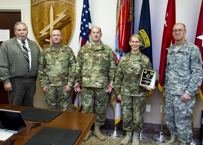 Mark Brooks, U.S. Army Reserve Command’s Chief, Antiterrorism Branch, Col. Douglas Smith, the USARC’s G-3/4, Col. George Hanhauser, U.S. Army Civil Affairs and Psychological Operations Command (Airborne) Chief of Staff, Capt. Wendy Nelson and Command Sgt. Maj. Peter Running, USACAPOC’s senior enlisted soldier, stand during the presentation of the 2014 USARC’s Best Antiterrorism Program during a ceremony held Oct. 26 at Fort Bragg, N.C. Nelson is the command’s antiterrorism program manager. (Army Reserve photo by Master Sgt. Mark Bell/released)