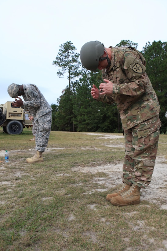 U.S. Army Command Sgt. Maj. Timothy Sullivan, Command Sgt. Maj. for Joint Communications Support Element, rehearses his exit position as part of pre-jump training during an airborne operations at Fort Bragg, N.C., Oct. 26, 2015. Sullivan is a guest jumper with U.S. Army Civil Affairs and Psychological Operations Command, as they conduct airborne operations in order to maintain proficiency and familiarization with the C-27 aircraft. (Photo by Sgt. 1st Class Sean A. Foley/Released)
