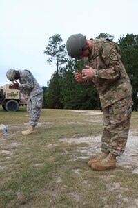 U.S. Army Command Sgt. Maj. Timothy Sullivan, Command Sgt. Maj. for Joint Communications Support Element, rehearses his exit position as part of pre-jump training during an airborne operations at Fort Bragg, N.C., Oct. 26, 2015. Sullivan is a guest jumper with U.S. Army Civil Affairs and Psychological Operations Command, as they conduct airborne operations in order to maintain proficiency and familiarization with the C-27 aircraft. (Photo by Sgt. 1st Class Sean A. Foley/Released)