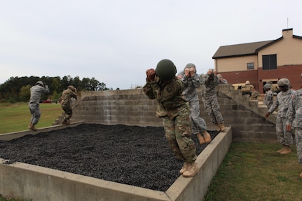 U.S. Army 1st Lt. Terrance Adams, a platoon leader with 982nd Combat Camera Signal Co. practices a parachute landing fall during pre-jump training at Fort Bragg, N.C., Oct. 26, 2015. 1st Lt. Adams is a guest jumper with U.S. Army Civil Affairs and Psychological Operations Command, as they conduct airborne operations in order to maintain proficiency and familiarization with the C-27 aircraft. Photo by Sgt. 1st Class Sean A. Foley (Released)