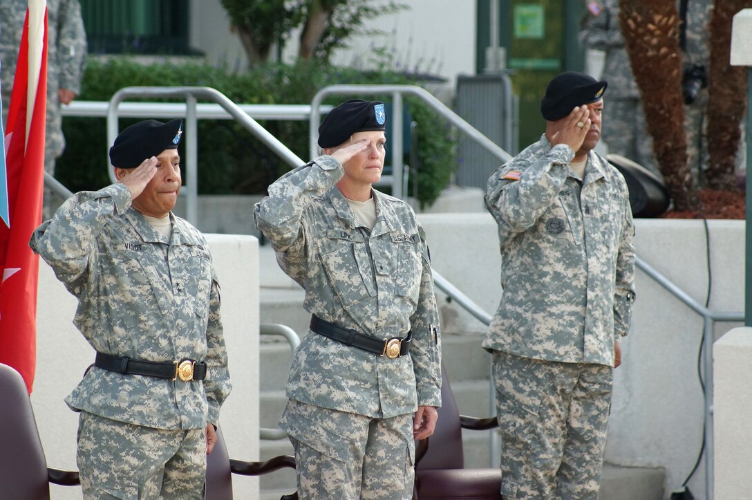 (From left to right) Maj. Gen. Luis R. Visot, the U.S. Army Reserve Command chief of staff, Maj. Gen. Mary E. Link, incoming commanding general of the Army Reserve Medical Command, and Command Sgt. Maj. Marlo V. Cross Jr, the incoming ARMEDCOM command sergeant major, salute the U.S. flag during the ARMEDCOM change of command ceremony held Sept. 26, 2015, at the C.W. Bill Young Armed Forces Reserve Center in Pinellas Park, Fla. Visot hosted the ceremony, in which Link and Cross assumed command and responsibility respectively from the outgoing command team of Maj. Gen. Bryan R. Kelly and Command Sgt. Maj. Harold P. Estabrooks.