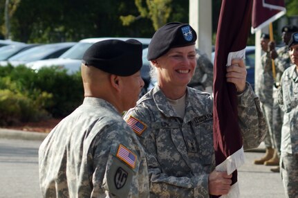 Maj. Gen. Mary E. Link, incoming commanding general of the Army Reserve Medical Command receives the guidon from Maj. Gen. Luis R. Visot, the U.S. Army Reserve Command chief of staff, during the ARMEDCOM change of command ceremony held Sept. 26, 2015 at the C.W. Bill Young Armed Forces Reserve Center in Pinellas Park, Fla. The transfer of the flag from Visot to Link signifies entrusting her with the authority and responsibility of command. Link served as the deputy commanding general for ARMEDCOM for three years prior to her promotion and subsequent assignment as the commanding general of ARMEDCOM.