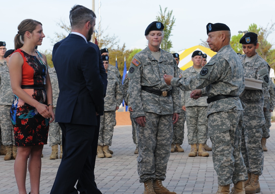 Brig. Gen. Mary E. Link, deputy commanding general of the Army Reserve Medical Command, receives promotion to major general in a ceremony held Sept. 26, 2015, at the C.W. Bill Young Armed Forces Reserve Center. The promotion ceremony was a true family affair. Link’s son’s, Matthew and Jacob Dona affixed her new two-star rank to her uniform and beret; Her brother, retired U.S. Air Force Col. Jon Link, administered the oath of office; and her daughter-in-law Kinsey Dona received flowers on her behalf. After the promotion ceremony, Link assumed command of ARMEDCOM in a change of command ceremony. In assuming her new post as commanding general, Link became the fifth commander and first woman in the ten-year history of the unit to take command.