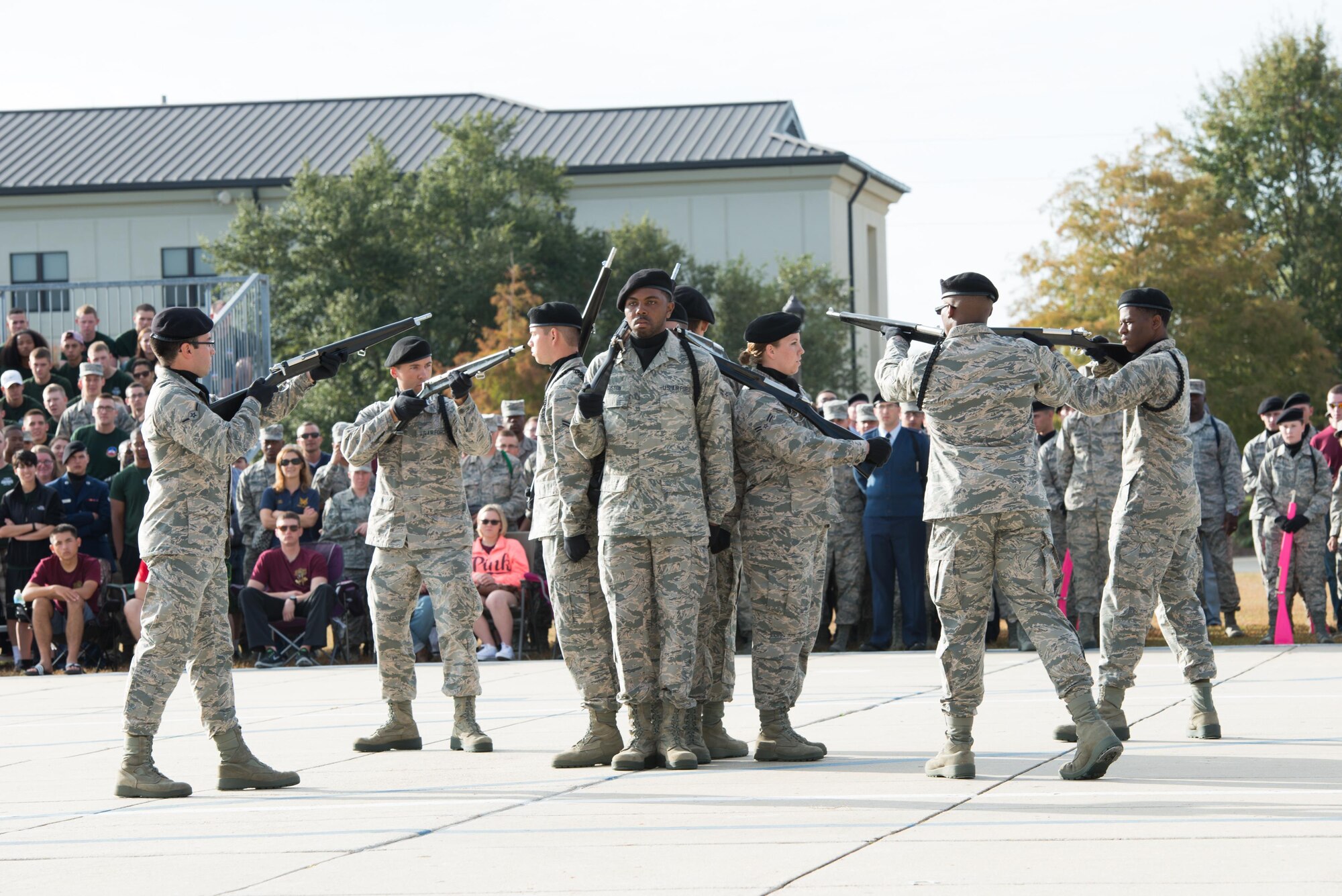Members of the 338th Training Squadron “Dark Knights” drill team perform during the 81st Training Group’s drill down competition at the Levitow Training Support Facility drill pad, Oct. 23, 2015, Keesler Air Force Base, Miss. The 338th TRS placed first in regulation and third in freestyle and overall. (U.S. Air Force photo by Marie Floyd)

