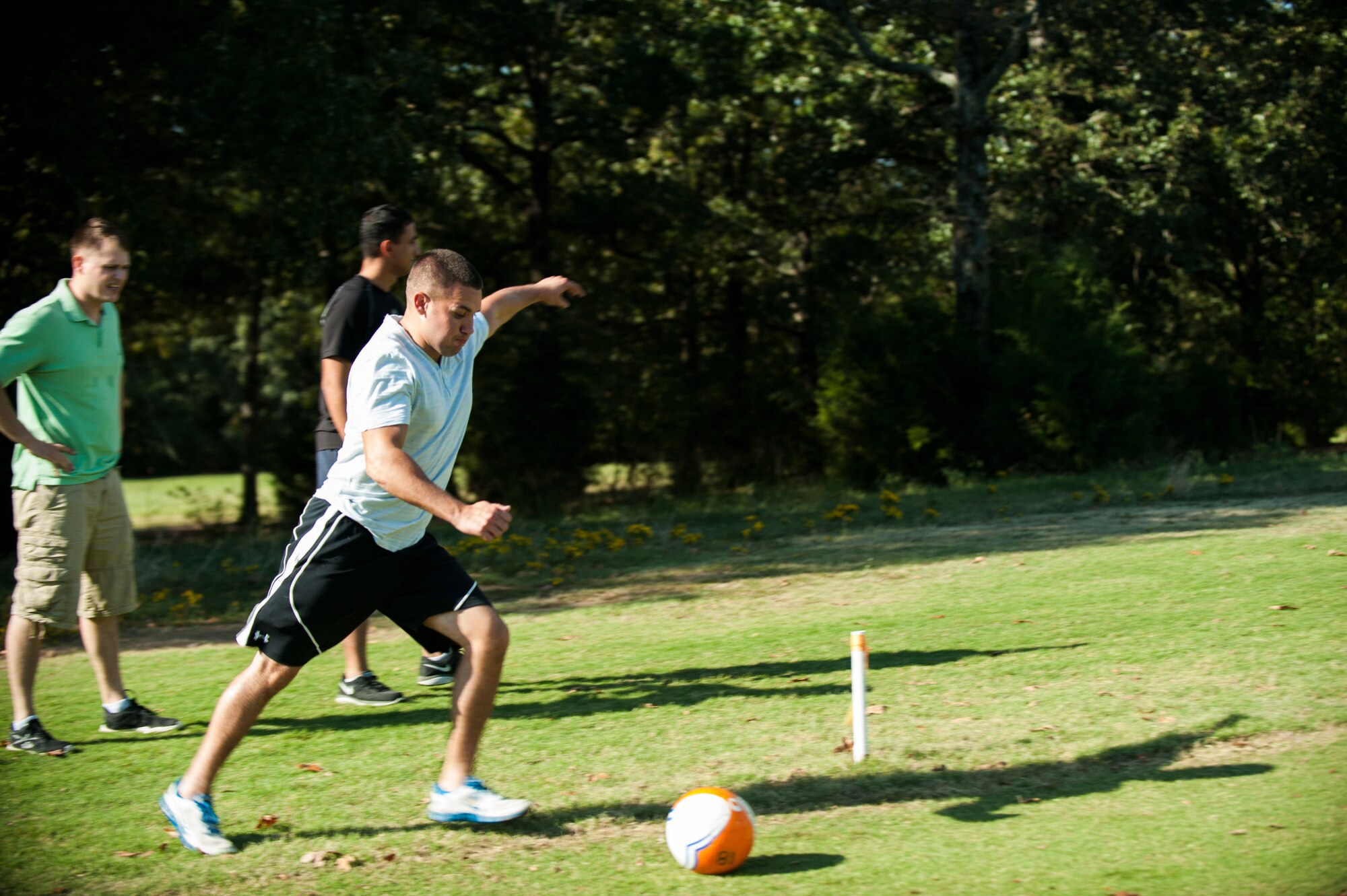 Staff Sgt. Derek  Hite prepares to kick during a round of FootGolf on Sept. 25, 2015, at Deer Run Golf Course at Little Rock Air Force Base, Arkansas. (U.S. Air Force photo/Senior Airman Stephanie Serrano/Released)