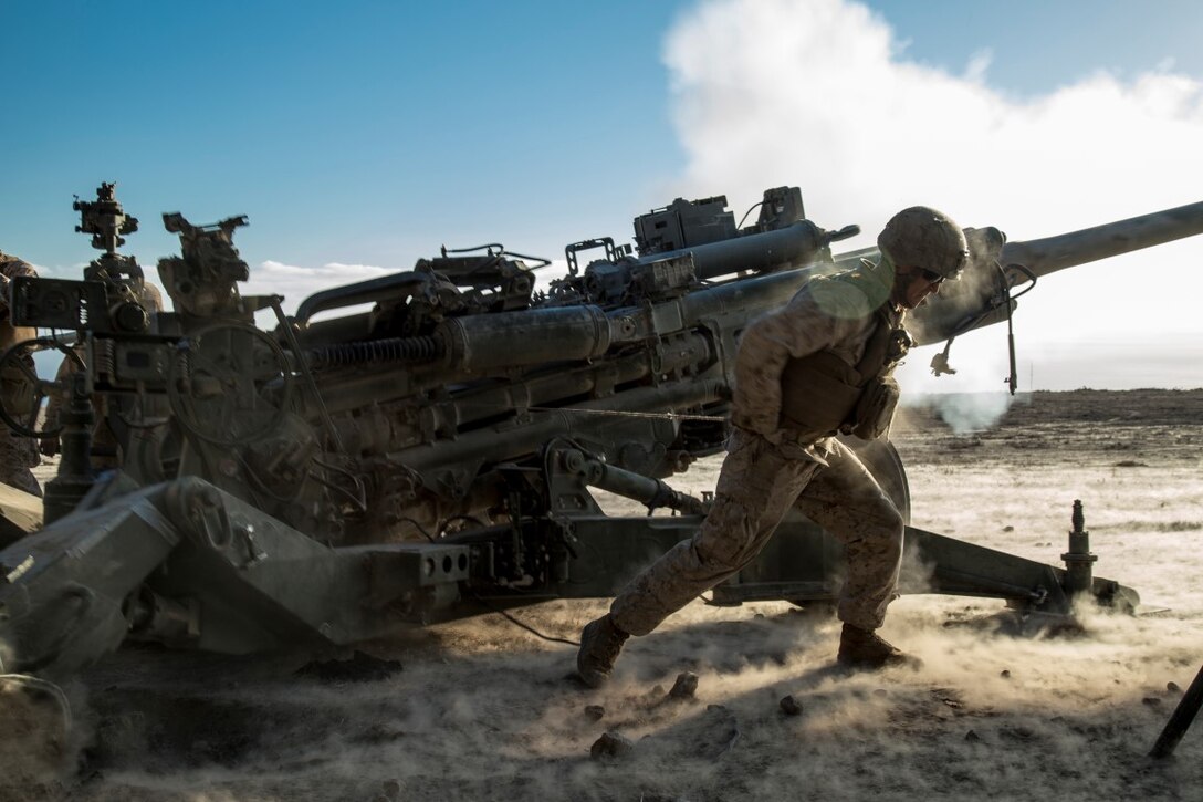 U.S. Marine Corps Lance Corporal Nicholas Bagwell with Battery “B”, 2nd Battalion, 1st Marine Regiment, fires a M777A2 Howitzer during Composite Training Unit Exercise (COMPTUEX) at San Clemente Island, Calif., on Oct. 22, 2015. COMPTUEX provides the PHIBRON-MEU the opportunity to integrate planning while also allowing focused, mission-specific training and evaluation for the Marines and their Navy Counterparts. (U.S. Marine Corps photo by Sgt. Hector de Jesus/Released)