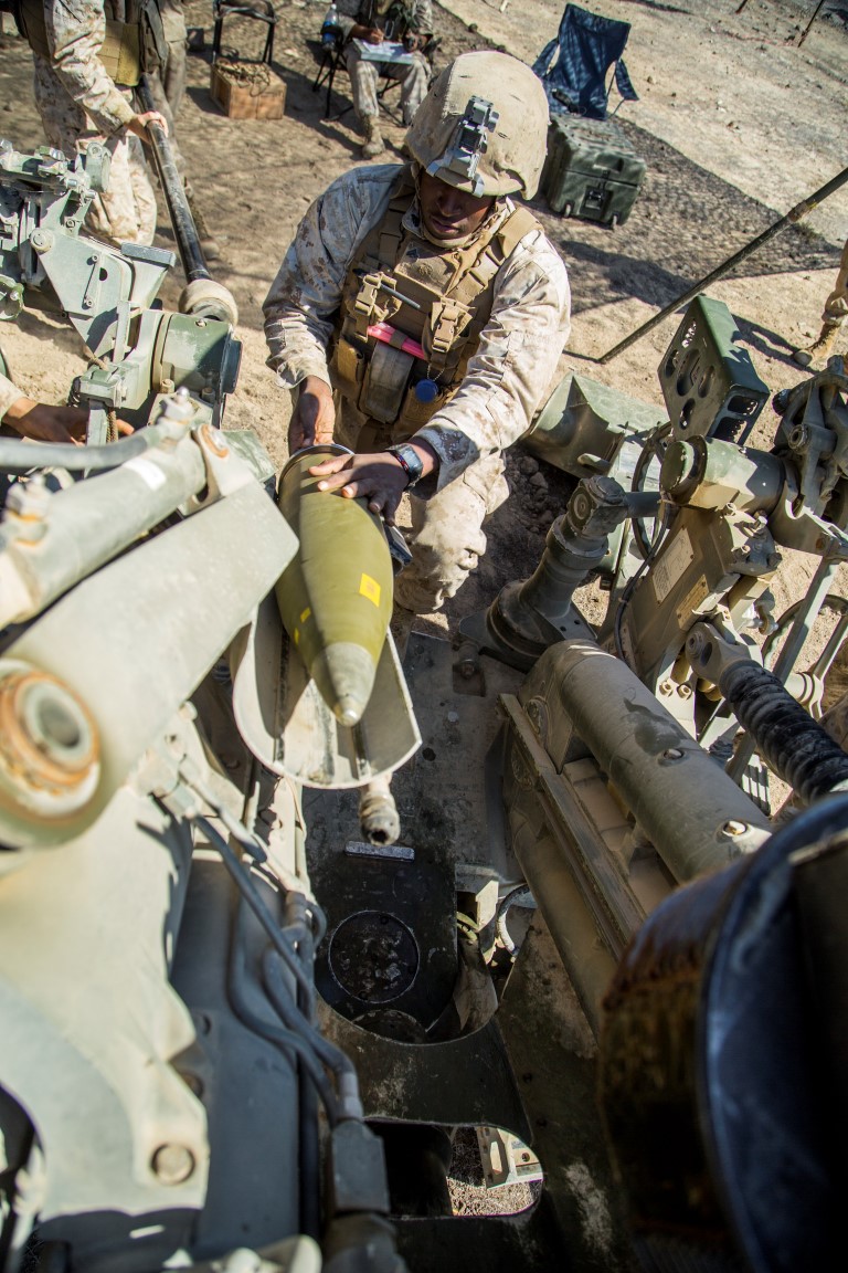 U.S. Marine Corps Corporal Travis Capps with Battery “B”, 2nd Battalion, 1st Marine Regiment, loads a M777A2 Howitzer during Composite Training Unit Exercise (COMPTUEX) at San Clemente Island, Calif., on Oct. 22, 2015. COMPTUEX provides the PHIBRON-MEU the opportunity to integrate planning while also allowing focused, mission-specific training and evaluation for the Marines and their Navy Counterparts. (U.S. Marine Corps photo by Sgt. Hector de Jesus/Released)