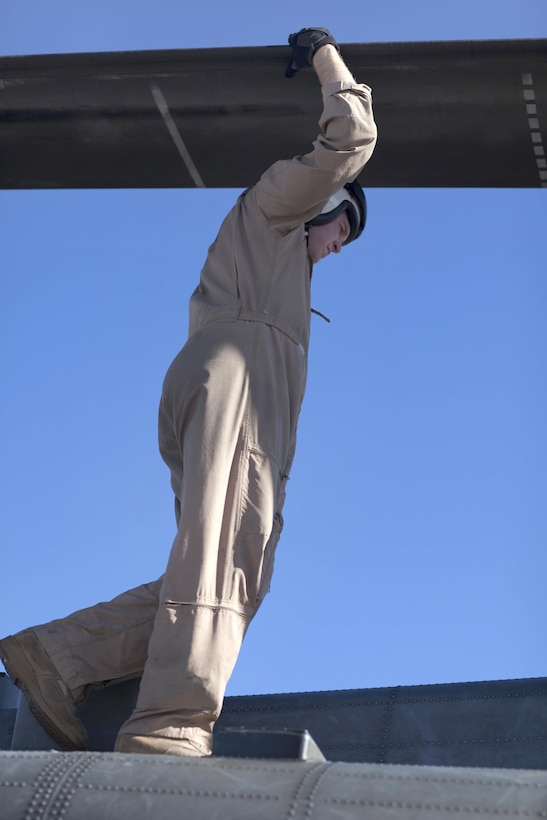 Marine Corps Capt. Benjamin Donaldson inspects a rotor blade on a CH-53E Super Stallion helicopter before rappelling training on Marine Corps Air Station New River, N.C., Oct. 20, 2015. Donaldson is a pilot assigned to Marine Heavy Helicopter Squadron 366. U.S. Marine Corps photo by Lance Cpl. Austin A. Lewis 