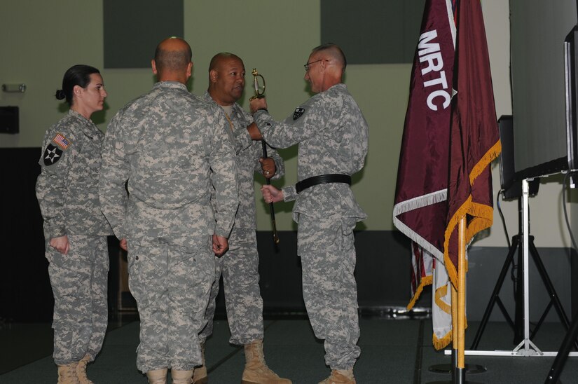 Command Sgt. Maj. Marlo V. Cross surrenders the sword to Brig. Gen. Michael C. O’Guinn, a Newark, Ohio, native and the current commander of the Medical Readiness and Training Command. O’Guinn accepts the noncommissioned officer sword expressing gratitude for the faithful service Cross has given his command, thus releasing Cross from his responsibilities with great respect and gratitude. This ceremony took place at the Army Reserve Medical Command Headquarters in the morning of Sept. 24, 2015.