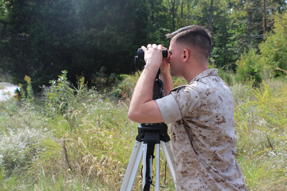 Cpl. Michael Greenberg, a collision investigator at Marine Corps Base Quantico, who is certified by the Department of Defense, trains on the Total Station, which is used to capture detailed measurements of a collision scene, Oct. 7.