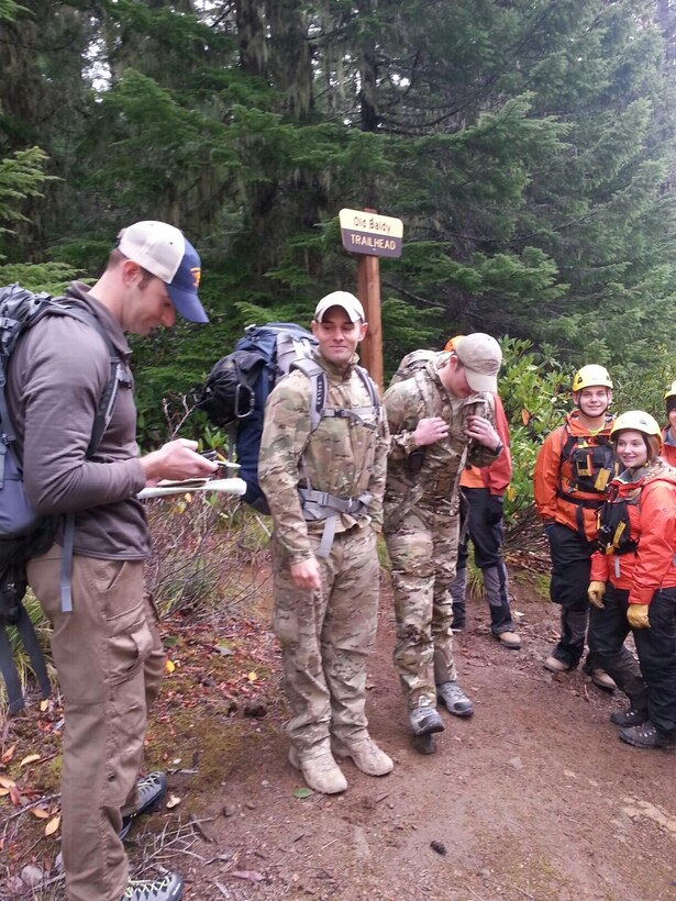 Senior Master Sgt. Josiah Blanton, (left), 304th Rescue Squadron Guardian Angel team leader, plots rescue coordinates prior to embarking on a search and rescue mission with Guardian Angel Airman and search and rescue volunteers October 26, 2015. The teams ultimately rescued two men who went missing in the remote Oregon wilderness area, 19 miles east Estacada, 45 miles east of Portland. (U.S. Air Force photo/Maj. Chris Bernard)
