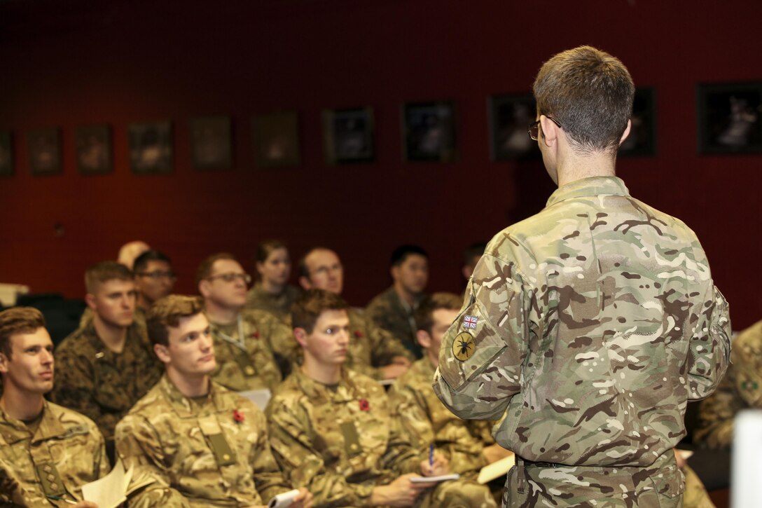 A British soldier addresses U.S. Marines and British soldiers before commencing Exercise Phoenix Odyssey II in Edinburgh, U.K., Oct. 25, 2015. The exercise is designed to bring both forces together to develop more effective ways to conduct joint intelligence operations and execute military skills. (U.S. Marine Corps photo by Pfc. Erick Galera/Released)