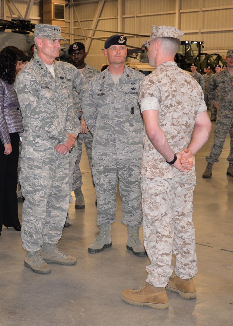 Lt. Gen. Darryl Roberson, commander, Air Education and Training Command, and Maj. Garon Shelton, 341st Training Squadron commander, speak to a Marine military working dog instructor course student Oct. 22, 2015, at Joint Base San Antonio-Lackland, Texas. Roberson visited the 37th Training Group High Bay area, where members of the 37th Training Group, the largest and most diverse training group in the Air Force, gave a visual display of their particular missions. The 341st TRS provides trained military working dogs and handlers for the Department of Defense and the Transportation Security Authority.