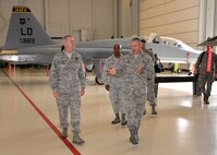 Lt. Gen. Darryl Roberson, commander, Air Education and Training Command, tours a hanger at the 318th Training Squadron from Brig. Gen. Trent Edwards, 37th Training Wing commander, and Lt. Col. William Latimer, 318th TRS commander, Oct. 22, 2015, at Joint Base San Antonio-Lackland, Texas. The 318th TRS, which belongs to the Inter American Air Forces Academy, provides Air Force technical training courses to South American partner nation service members. The courses, taught by U.S. Airmen, are taught completely in Spanish. (