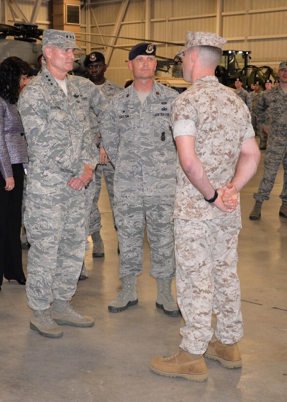 Lt. Gen. Darryl Roberson, commander, Air Education and Training Command, and Maj. Garon Shelton, 341st Training Squadron commander, speak to a Marine military working dog instructor course student Oct. 22, 2015, at Joint Base San Antonio-Lackland, Texas. Roberson visited the 37th Training Group High Bay area, where members of the 37th Training Group, the largest and most diverse training group in the Air Force, gave a visual display of their particular missions. The 341st TRS provides trained military working dogs and handlers for the Department of Defense and the Transportation Security Authority.