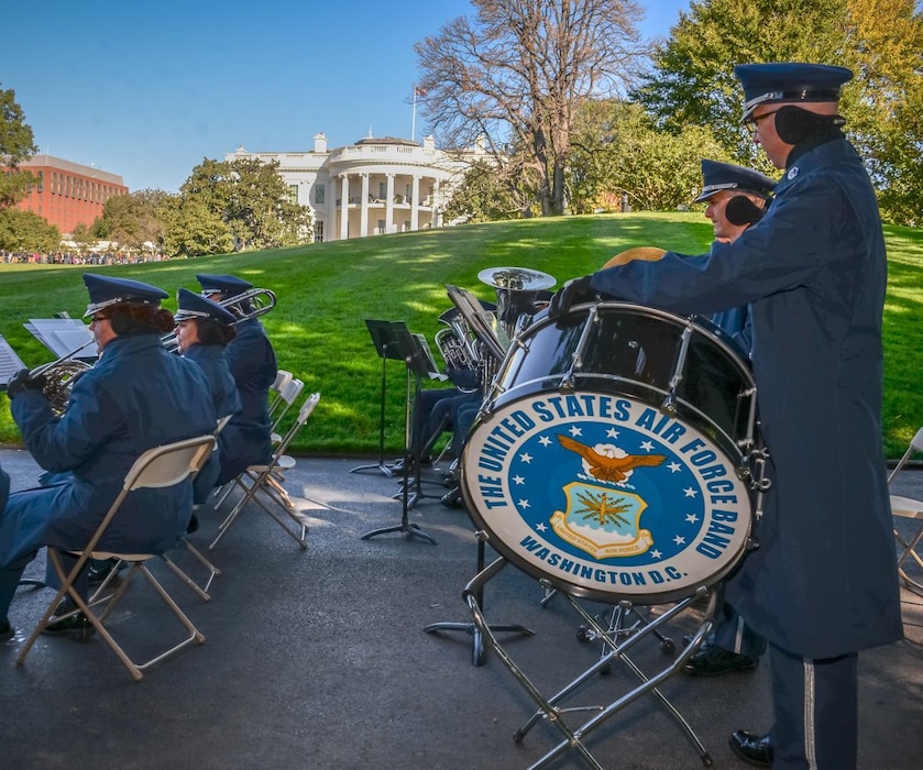The Ceremonial Brass entertains visitors at the Fall 2015 White House Garden Tour Oct. 18, under the direction of Captain Haley Armstrong. The band played to crowds of hundreds of people who were both waiting in line and walking the White House grounds. (Courtesy photo by Scott Pauley)