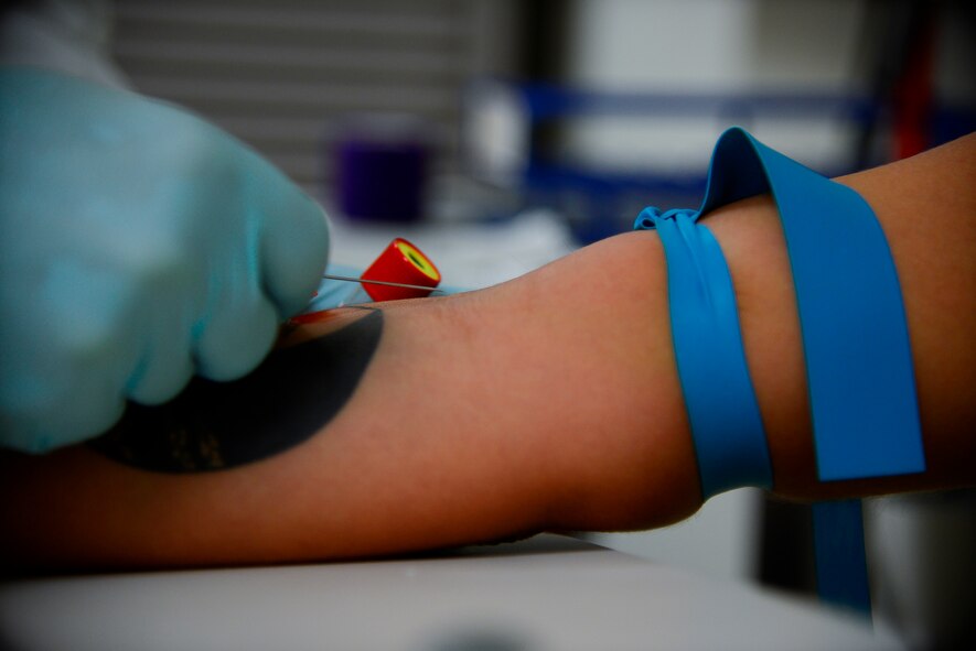 A laboratory technician guides a needle to draw blood from a patient's vein in the 51st Medical Support Squadron laboratory at Osan Air Base, Republic of Korea, Oct. 21, 2015. The lab houses a blood bank that holds no less than four 500ml units of blood for emergency use. The lab can also test a pregnant woman's blood type to determine if she could be incompatible with the unborn child. If an incompatibility is identified, a doctor will prescribe a drug to counteract the body's reaction. (U.S. Air Force photo/Tech. Sgt. Travis Edwards)