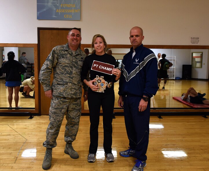From left to right, Master Sgt. Paul Watts, 341st Munitions Squadron munitions accountable systems supervisor, Dr. Elin Pierce, 341st Civil Engineer Squadron fish and wildlife biologist, and Master Sgt. Robert Taylor, 341st CES first sergeant, pose for a photograph after the Malmstrom Air Force Base physical training competition Oct. 27, 2015. Pierce took first place in the competition. (U.S. Air Force photo/Airman Collin Schmidt)
