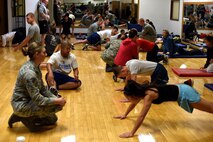 Participants of the Malmstrom Air Force Base physical training competition complete the pushup portion of the event at the Malmstrom Fitness Center Oct. 27, 2015. Performance techniques and the scoring system were based on guidance contained in the Air Force fitness instruction. (U.S. Air Force photo/Airman Collin Schmidt) 