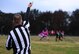 Tech Sgt. Christopher Milby, 509th Communications Squadron unit training manager, marks the line of scrimmage during the intramural flag-football championship game at Whiteman Air Force Base, Mo., Oct. 26, 2015. The 509th Security Forces Squadron defeated the 509th Operations Support Squadron with a score of 32-24. (U.S. Air Force photo by Senior Airman Joel Pfiester/Released)